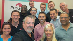 Trainer Jean-Marc Julien (centre) and the latest class to graduate from the Assured Automotive Training Academy.