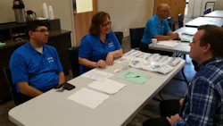 Representatives of CSN-427 Auto Collision interview a prospective employee at AYCE's most recent career fair.