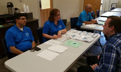 Representatives of CSN-427 Auto Collision interview a prospective employee at AYCE's most recent career fair.