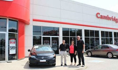 Allen Mattice of CARSTAR Cambridge and Nicole Pereir, General Manager, and Rich Snider, Parts and Service Director, for Cambridge Centre Honda.