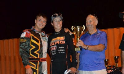 Austin Riley (left) and Dana Alexander present the CSN trophy to Stephen Oliver.