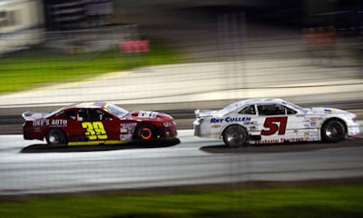 Competitors fly around the track at the recent ISMA race sponsored by Don-Mor CARSTAR Collision.