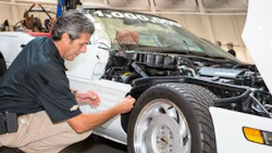 General Motors Global Design Fabrication Operations Director David Bolognino attaches the final panel to complete the restoration the 1-millionth Corvette Thursday, September 3, 2015 at the National Corvette Museum in Bowling Green, Kentucky.