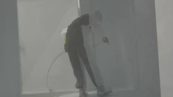 A painter coats the inside of a trailer at Three Star Trucking. The company recently started offering its heavy repair services to other operators.