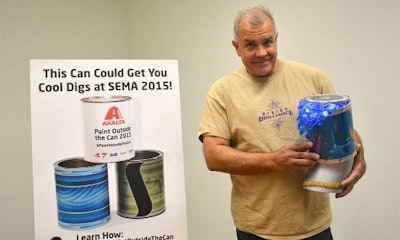 Paul Quinn, renowned airbrush and pinstriping artist and instructor in the custom paint industry, served as one of the celebrity judges Quinn is shown here holding Mike “Splash” Burton’s “Paradise Pipeline,” which swept the contest by winning in the categories of Fan Favorite and Celebrity Pick, as well as the Grand Prize.