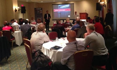 Michael Macaluso, President of CARSTAR Automotive Canada, taking the stage at the CARSTAR multi-store owner performance group meeting.