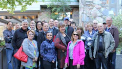 Attendees of the LJ Peters 13th Annual Summit on the steps of the Fairmont Chateau Whistler, prior to the start of the 'Amazing Race' a team building event that saw attendees engage in a massive scavenger hunt around Whistler.