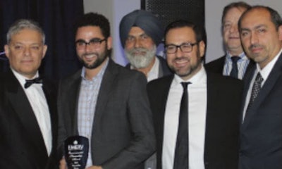 Adam and Paul Prochilo (centre, front row) accepting the Environmental Stewardship Award.