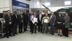 The team at CSN-Automacs Collision receives their certification plaques from Scott Wideman of Volkswagen Group Canada.