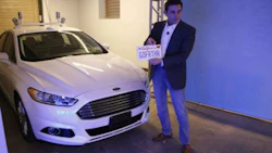 Ford has secured permission to test its autonomous vehicles in California. CEO Mark Fields commemorates the occasion by placing the license plate on an autonomous Fusion Hybrid.