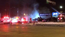 Fire crews battle the blaze in Winnipeg. No injuries were reported, but witnesses say as many as 40 cars may have been inside the building.