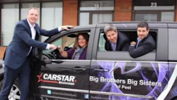CARSTAR Regional Development Manager Jeff Moriarity and franchise partners Robin Juns and Sam Saccoia present the van to Shari Lynn Ladanchuk, President & CEO of Big Brothers Big Sisters.