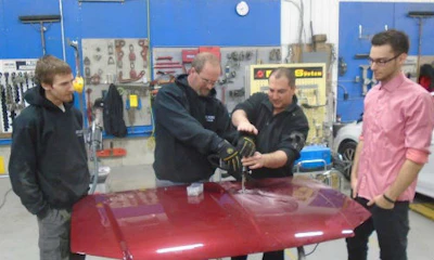 Errol Cowan of Titanium Tools & Equipment (centre) demos the Miracle System for some of the staff at CSN-Carlaw Collision.