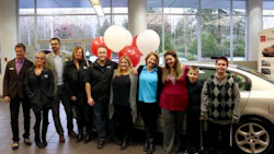 Noelani Dreger, her sons Gaberial and William, and some of the team from Fix Auto Abbotsford who helped get Dreger into a refurbished Nissan Altima in time for the holidays.