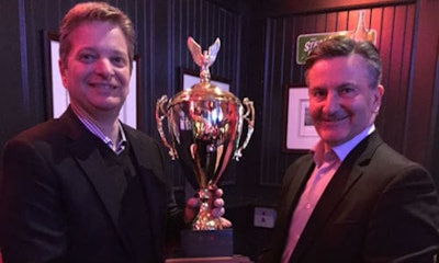 Rick Orser (right) of 3M Canada presents the Rick Berg Award to Pierre Seguin, Sales Executive for Eastern Ontario.
