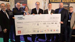 The donation. From left: Serge Gauthier, Luc Langlois, Roger Goudreau, Rachel Leduc, Luc Champagne, Jean Lemieux, Denis Dessureault and Alain Morin. Photo by Guy O’Bomsawin.
