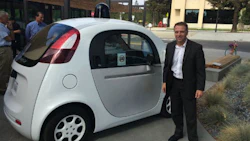 Mark Francis of ICBC with one of Google's self-driving cars. Francis believes insurance premiums will likely decrease as a result of AVs.