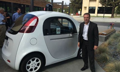 Mark Francis of ICBC with one of Google's self-driving cars. Francis believes insurance premiums will likely decrease as a result of AVs.