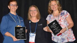 Shellie Andrews (left) and Katie Henwood (right) accepting the WIN Cornerstone Award from Denise Caspersen (centre).