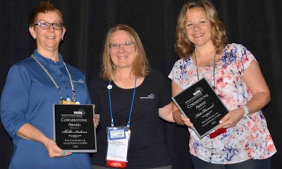 Shellie Andrews (left) and Katie Henwood (right) accepting the WIN Cornerstone Award from Denise Caspersen (centre).