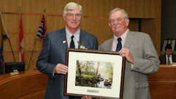 Bernhard Rubbert of False Creek Collision accepts the award from Derek Corrigan, Mayor of Burnaby.
