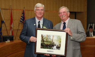 Bernhard Rubbert of False Creek Collision accepts the award from Derek Corrigan, Mayor of Burnaby.