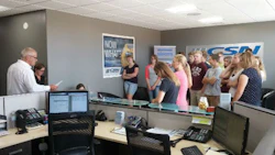 John and Joanne Hutten (far left) conduct a tour of their new facility for students from Emmanuel Christian High School.