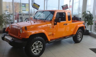 There's no mistaking this converted Jeep for a stock model. The conversion to a mini pick-up was done with a Mopar body kit.