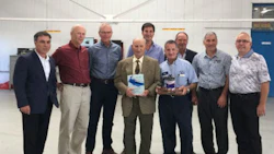 Ralph D'Alessandro, centre, with representatives of AkzoNobel, Treschak Enterprises and CSN-427 Auto Collision. D'Alessandro was recently honoured as the first Sikkens customer in North America.