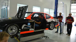 A full-motion race car simulator helped draw the 800-plus crowd for CSN-Hutten Collision's fundraising Open House