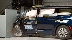 The Chrysler Pacifica during the challenging small overlap front test. The vehicle was retested by IIHS after FCA made changes to prevent the driver's door from opening during this type of collision.