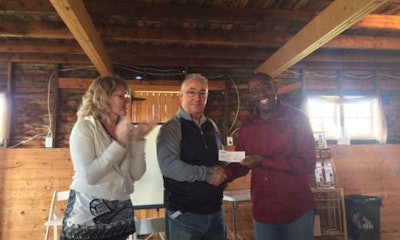 Tom Bissonnette of Parr Auto Body and former Chairman of CCIF (centre) with Marc and Lisa Honorat, founders of Haiti ARISE. The organization is raising funds to add collision repair training to the skills offered at the Haiti ARISE Technical & Professional School.