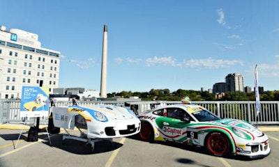 The hospital bed customized by Pfaff Autoworks, next to the Porsche 911 GT3 Cup race car it was modeled on. The bed will help to promote fundraising efforts to replace the beds at North York General Hospital.