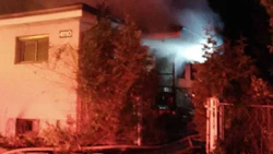A blaze broke out at a house attached to Leitrim Body Shop in Ottawa. Photo by Scott Stilborn/Ottawa Fire Services.
