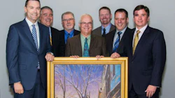 Axalta Coating Systems recently honoured its 60-year partnership with NAPA Canada at its Canadian headquarters in Montreal, Quebec. From left: Representing NAPA Canada, Alain Masse, President of UAP; Eric Léveillé, Vice President, CMAX and Paint & Body Supplies; Tom Hunt, Vice President, Product Development; Representing Axalta, Robert Searle, Refinish Product & Marketing Manager-Axalta Canada; Benoit Goulet, Regional Sales Manager, Quebec/Atlantic-Axalta Canada; Brent Jamieson, Axalta North America Sales Director; and Troy Weaver, Axalta Business Director pose with Axalta's gift to NAPA titled 'Winter Evening, St-Lawrence Boulevard' by Montreal artist Richard Montpetit. Photo by Eve Richard.