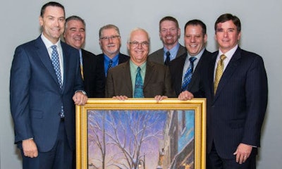 Axalta Coating Systems recently honoured its 60-year partnership with NAPA Canada at its Canadian headquarters in Montreal, Quebec. From left: Representing NAPA Canada, Alain Masse, President of UAP; Eric Léveillé, Vice President, CMAX and Paint & Body Supplies; Tom Hunt, Vice President, Product Development; Representing Axalta, Robert Searle, Refinish Product & Marketing Manager-Axalta Canada; Benoit Goulet, Regional Sales Manager, Quebec/Atlantic-Axalta Canada; Brent Jamieson, Axalta North America Sales Director; and Troy Weaver, Axalta Business Director pose with Axalta's gift to NAPA titled 'Winter Evening, St-Lawrence Boulevard' by Montreal artist Richard Montpetit. Photo by Eve Richard.