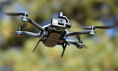 Ford is examining the possibility of using flying drones, launched from an autonomous vehicle, that would help the self-driving car navigate.