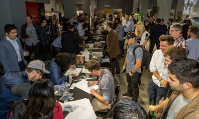 The crowd watches as design contestants engage in a sketch competition at the 2016 Middlecott Sketchbattle Los Angeles presented by BASF.