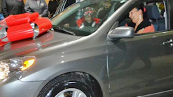 Joi Saunders sits in her new vehicle. She received the car thanks to the efforts of CSN-Superior Collision and other local businesses and individuals.