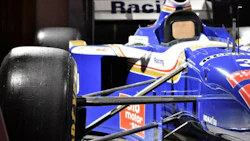 Villeneuve’s 1997 Williams FW19 on display at the AutoShow. The car still bears the tire mark from where another driver tried to run him off the track.