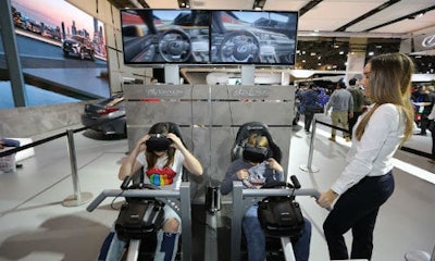 Young AutoShow attendees experience virtual reality (VR) racing at the Lexus display. VR seems to be a large part of this year's offering.