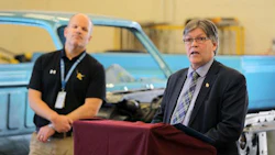Manitoba’s Education and Training Minister, Ian Wishart, announced that the province would commit $347,453 to Crocus Plains Regional Secondary School’s collision program. The school’s principal is Chad Cobbe (right). Photo by the Brandon Sun.
