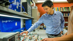 Kevin Fu of the University of Michigan shows how acoustic waves can interfere with the data that certain accelerometer sensors are monitoring. These sensors are found in a wide variety of technologies, including AVs. Photo by Joseph Xu, Michigan Engineering.