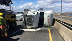 Strong winds blew over a transport truck on the Skyway bridge in Hamilton, Ontario, leading police to close the bridge citing safety concerns. Photo by Kerry Schmidt.
