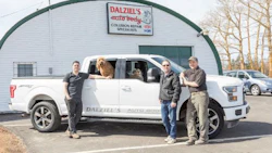 A few members of the Dalziel family and members of the management staff at Dalziel's Auto Body. From left: Chris Dalziel, Operations Manager; Jeff Dalziel, Assistant Manager and John Dalziel, Manager. The dogs, Bella and Ozzie, are not officially on staff.