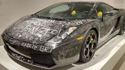 An art piece entitled 'Low Key' on display at a museum in Denmark. Patrons were encouraged to leave their mark on a once-pristine Lamborghini.