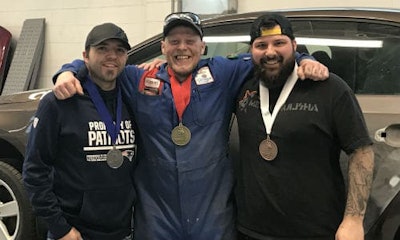 Newfoundland's Autobody Repair gold medalist Robert Hulan (centre) with silver medalist Patrick Noseworthy (left) and bronze medalist Jonathan Payne (right). All three are students at College of the North Atlantic in St. John’s.
