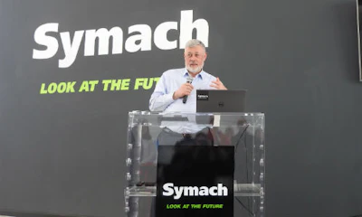 Osvaldo Bergaglio, President of Symach, outlines his company’s technology during the Symach factory tour.