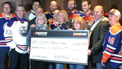 CARSTAR franchise partners, staff and members of the Edmonton Oilers Communication Foundation present the donation to Cystic Fibrosis Canada.