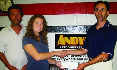 Rob Heslop from Andy’s Auto Wreckers with his daughter Lindsay, receiving her OARA scholarship cheque from Steve Fletcher of OARA. Heslop’s daughter Lauren received an OARA Scholarship this year, being the fourth of his children to do so.